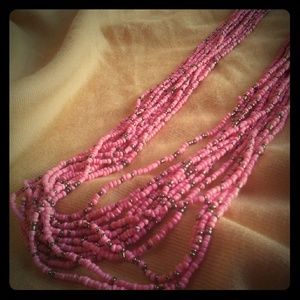 Lot of 12 long coral pink and gold necklaces